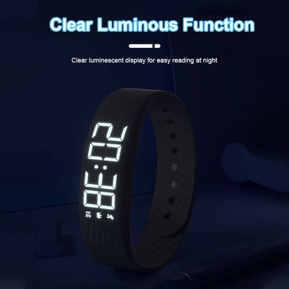 The LED display glowing in a dark bedroom, readable at night without turning on a light